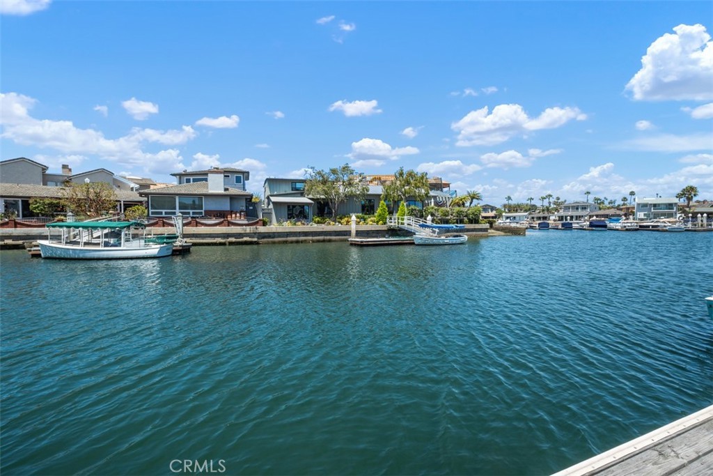 3810 Channel Place Newport Beach, CA 92663 - Photo 6 of 43 a view of a lake with boats and trees