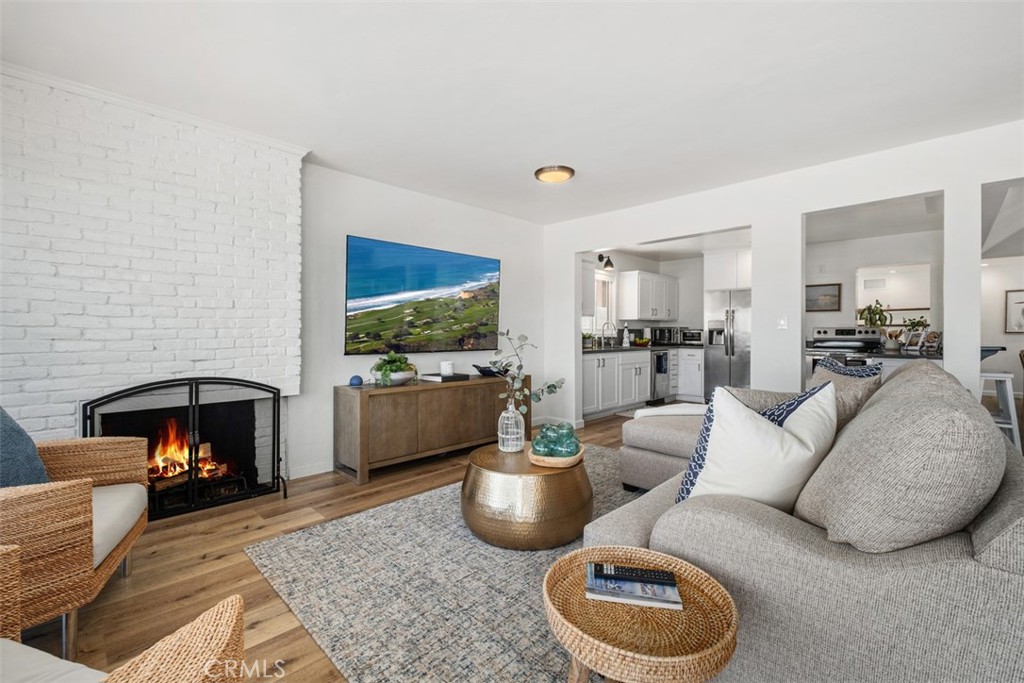 3810 Channel Place Newport Beach, CA 92663 - Photo 8 of 43 a living room with furniture and a fireplace