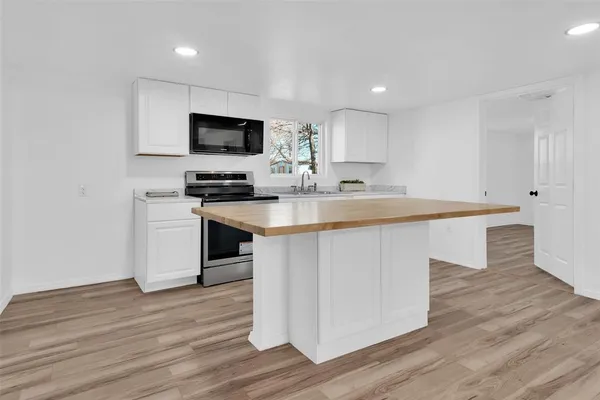 an empty room with wooden floor