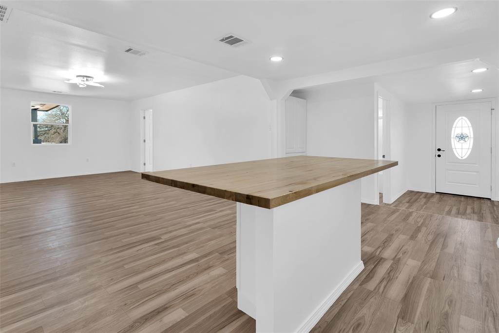 909 East Sears Street Denison, TX 75021 - Photo 7 of 24 Foyer featuring light wood-type flooring and recessed lighting