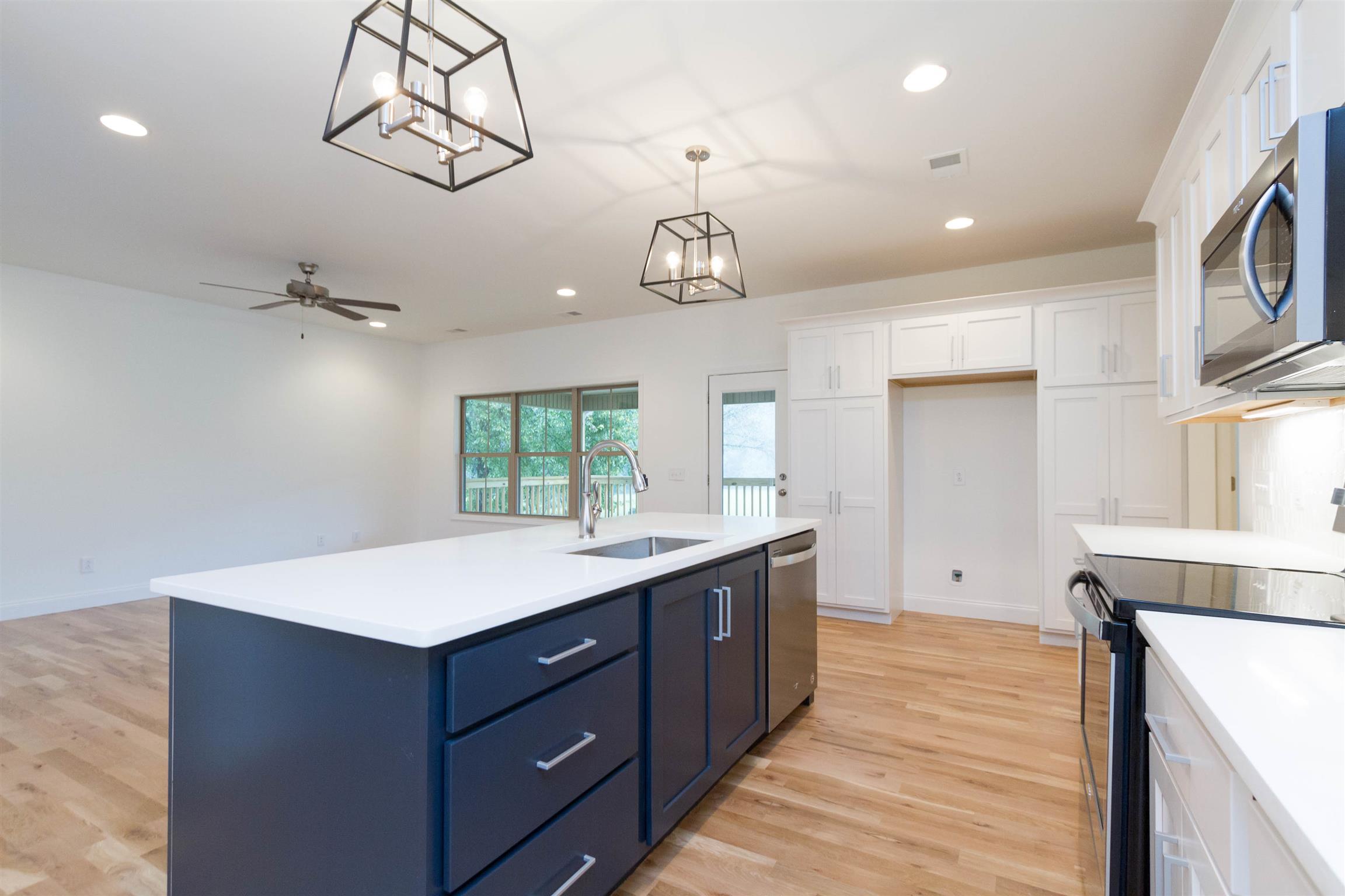 4751 Kinneys School Road Springfield, TN 37172 - Photo 6 of 30 a kitchen with a sink and dishwasher with wooden floor