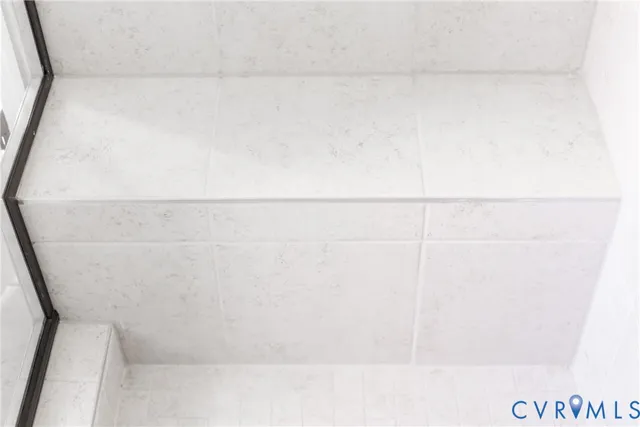 a bathroom with a sink vanity and mirror