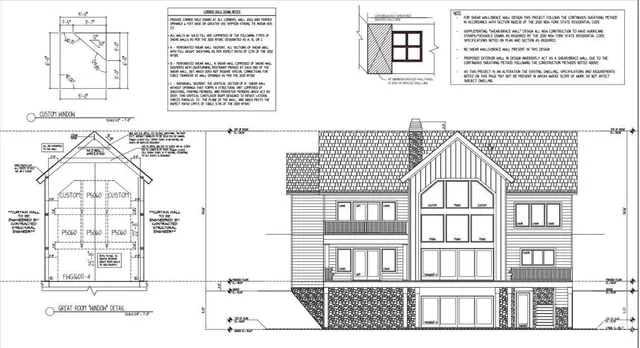 an aerial view of residential house and sandy dunes