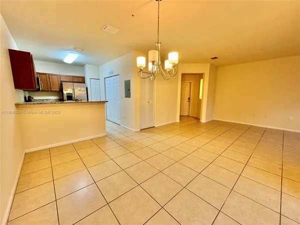 a view of empty room with a bathroom