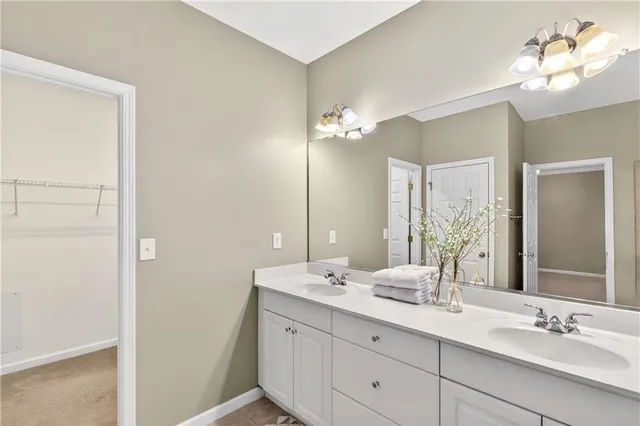 a view of an empty room with a ceiling fan