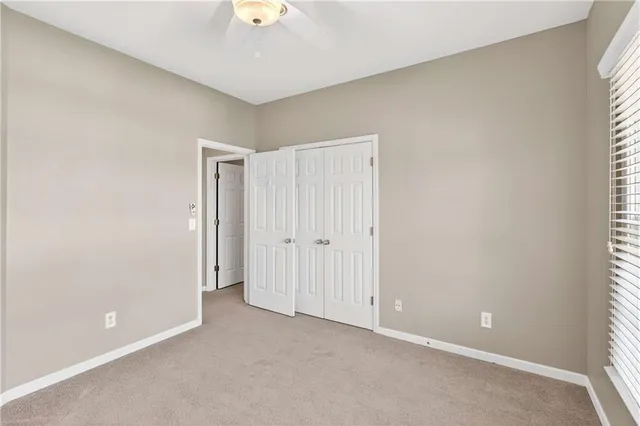 a backyard of a house with yard and outdoor seating