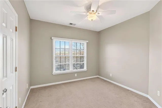 a view of house with a yard