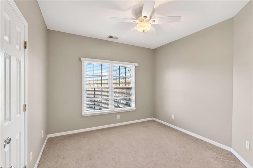 5731 Vinings Retreat Way Southwest Mableton, GA 30126 - Photo 21 of 32 an empty room with a window