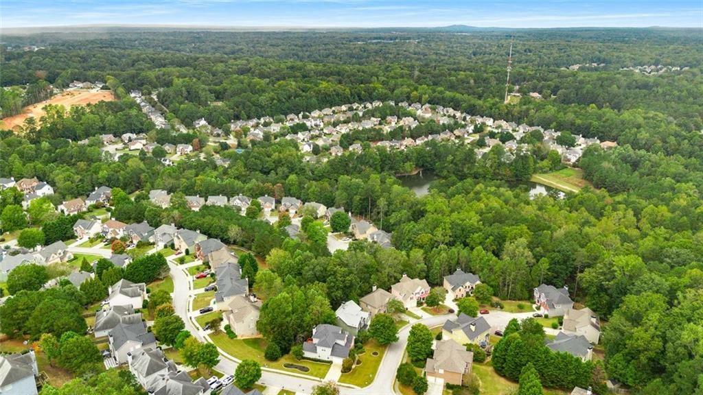 5731 Vinings Retreat Way Southwest Mableton, GA 30126 - Photo 32 of 32 a view of a lot of trees and flowers