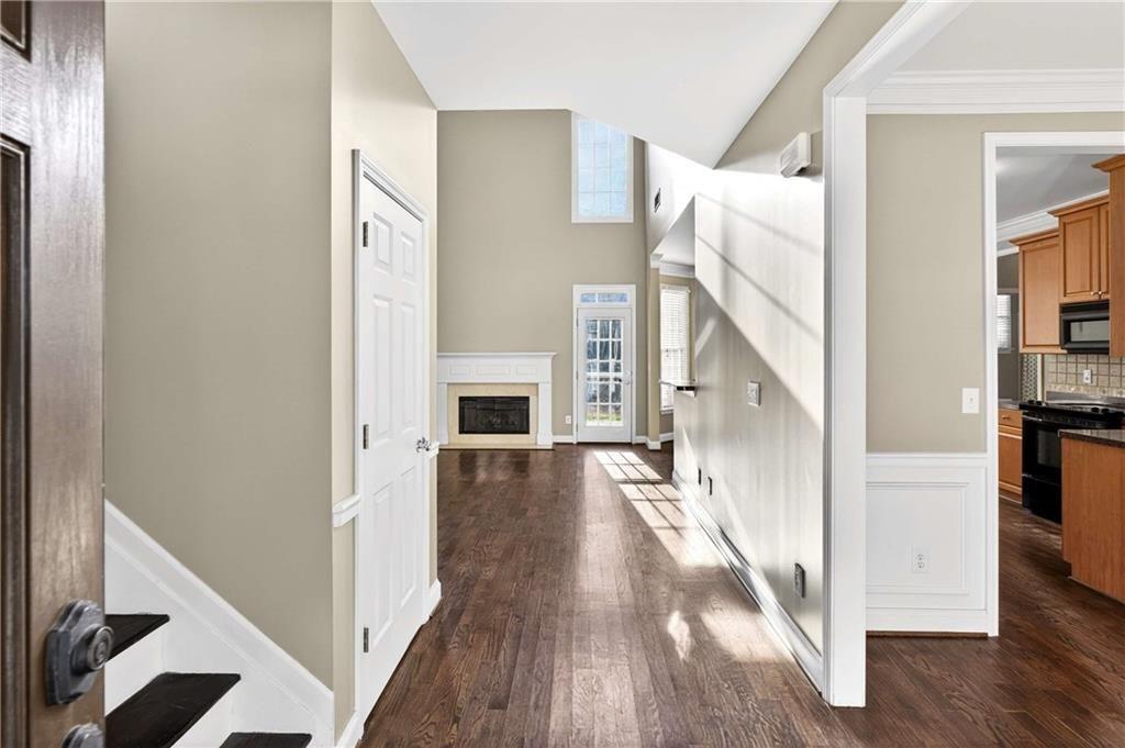 5731 Vinings Retreat Way Southwest Mableton, GA 30126 - Photo 9 of 32 a view of a livingroom with wooden floor and staircase