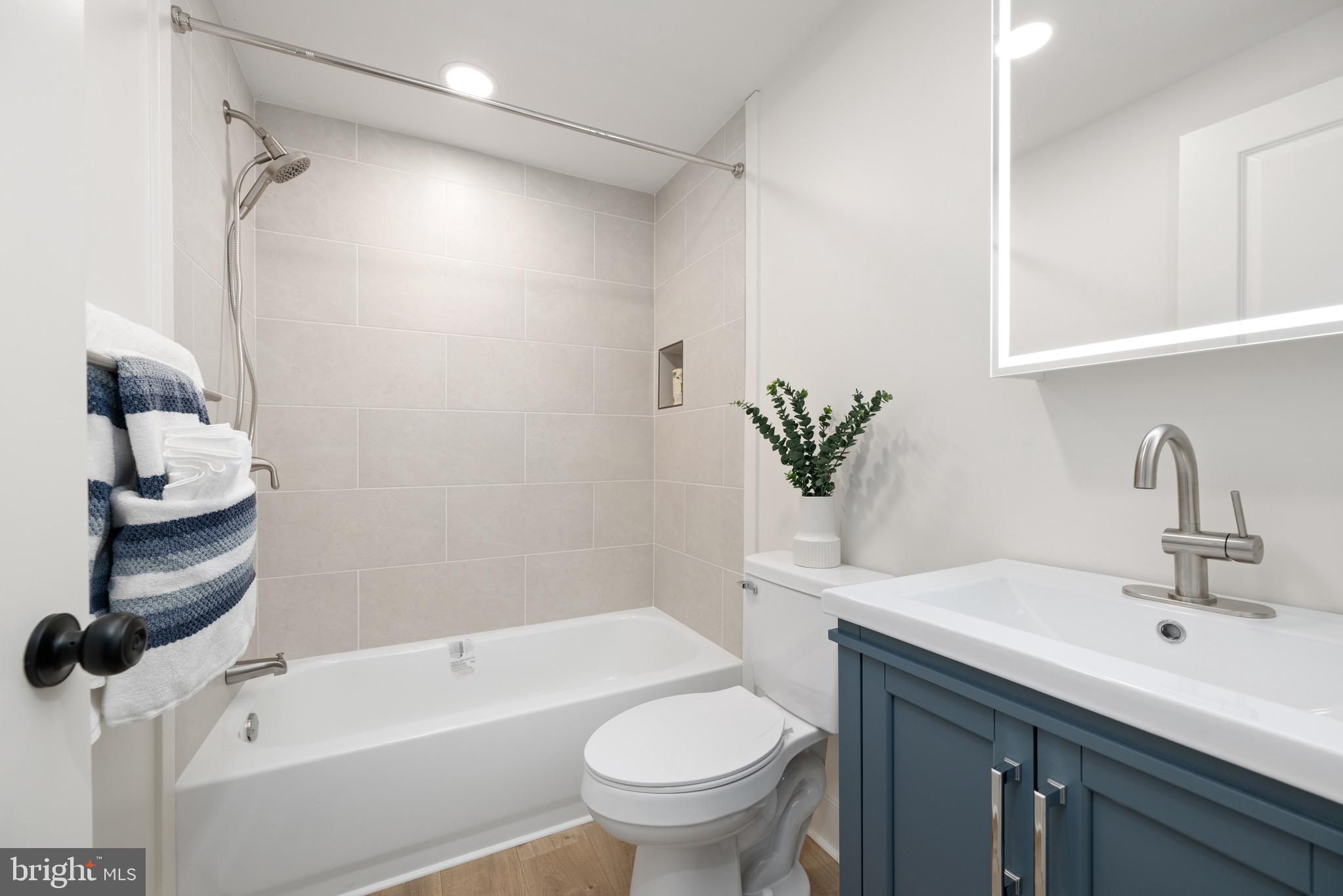 18316 Shingle Point Road Georgetown, DE 19947 - Photo 20 of 35 a bathroom with a sink toilet and shower