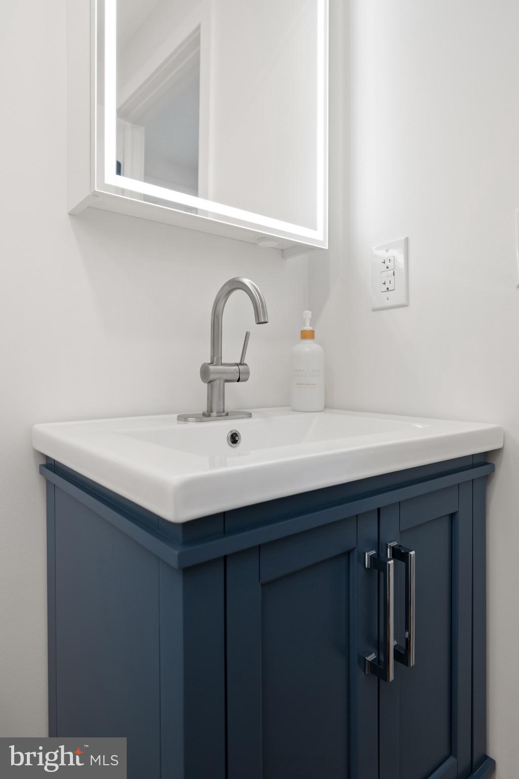 18316 Shingle Point Road Georgetown, DE 19947 - Photo 21 of 35 a sink with a vanity