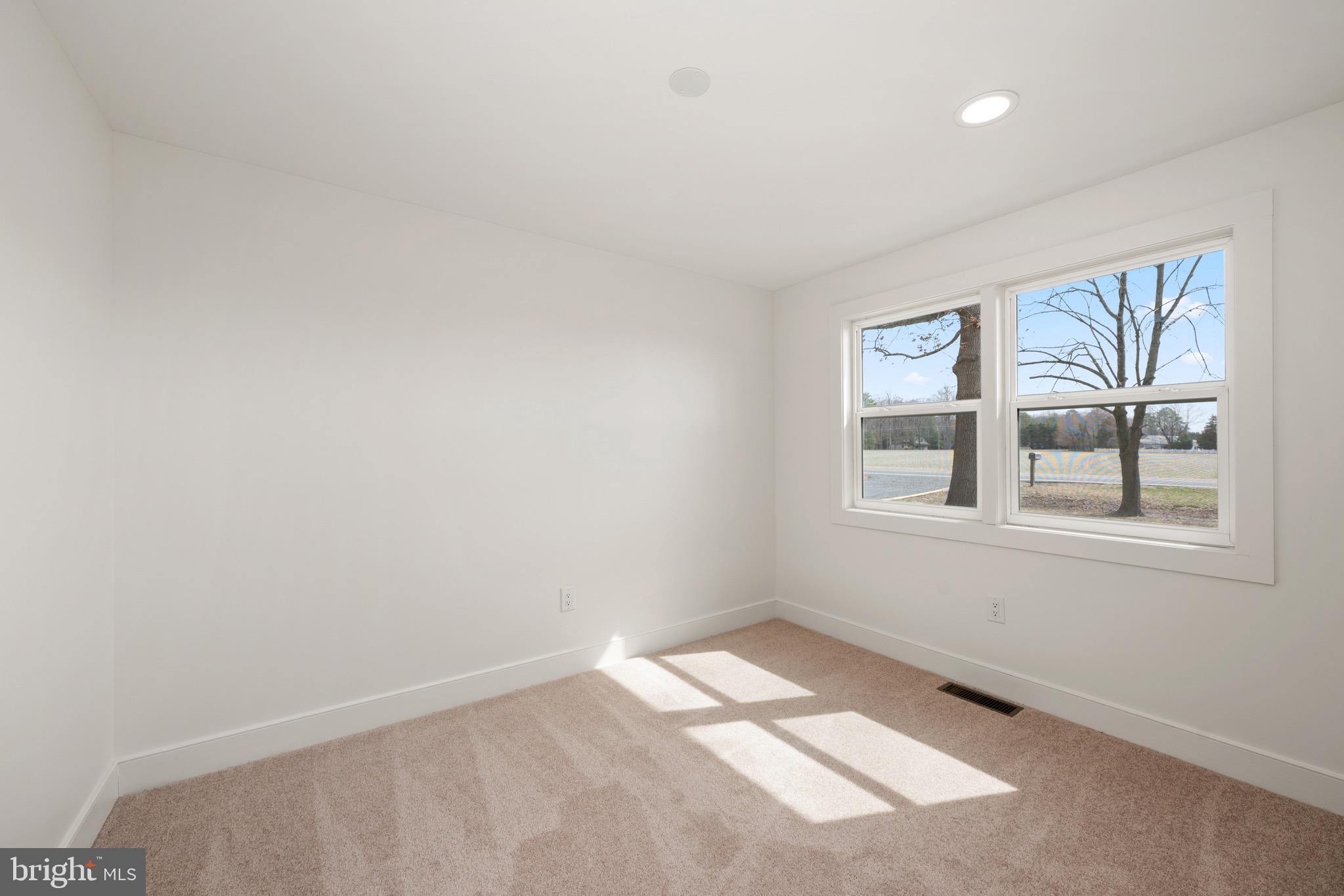 18316 Shingle Point Road Georgetown, DE 19947 - Photo 22 of 35 an empty room with windows