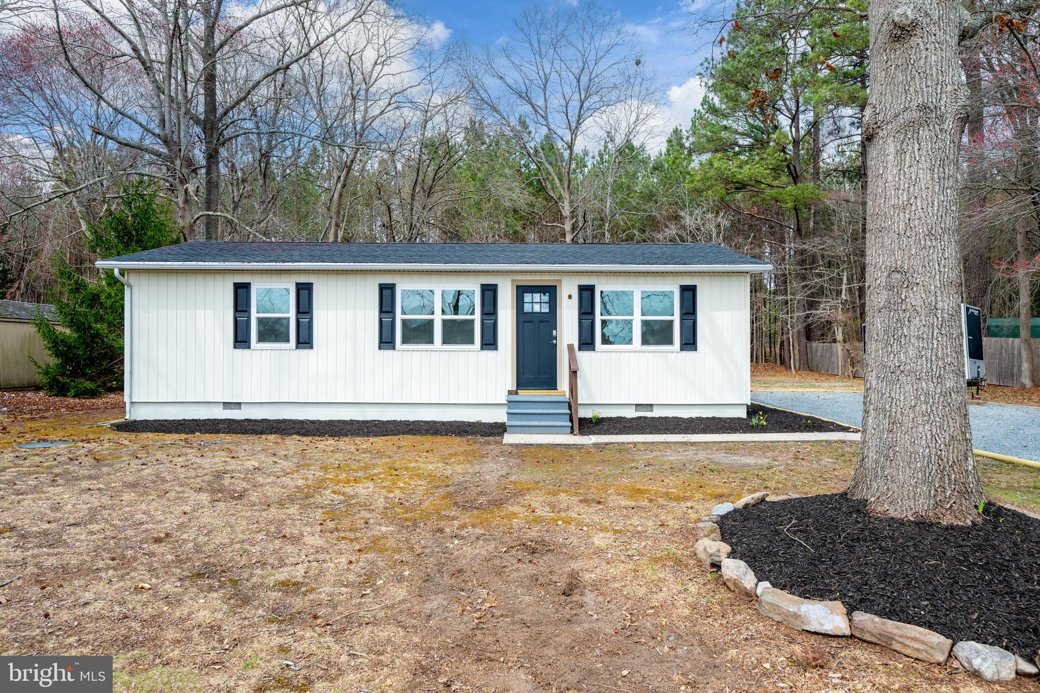 18316 Shingle Point Road Georgetown, DE 19947 - Photo 3 of 35 a view of a house with a yard