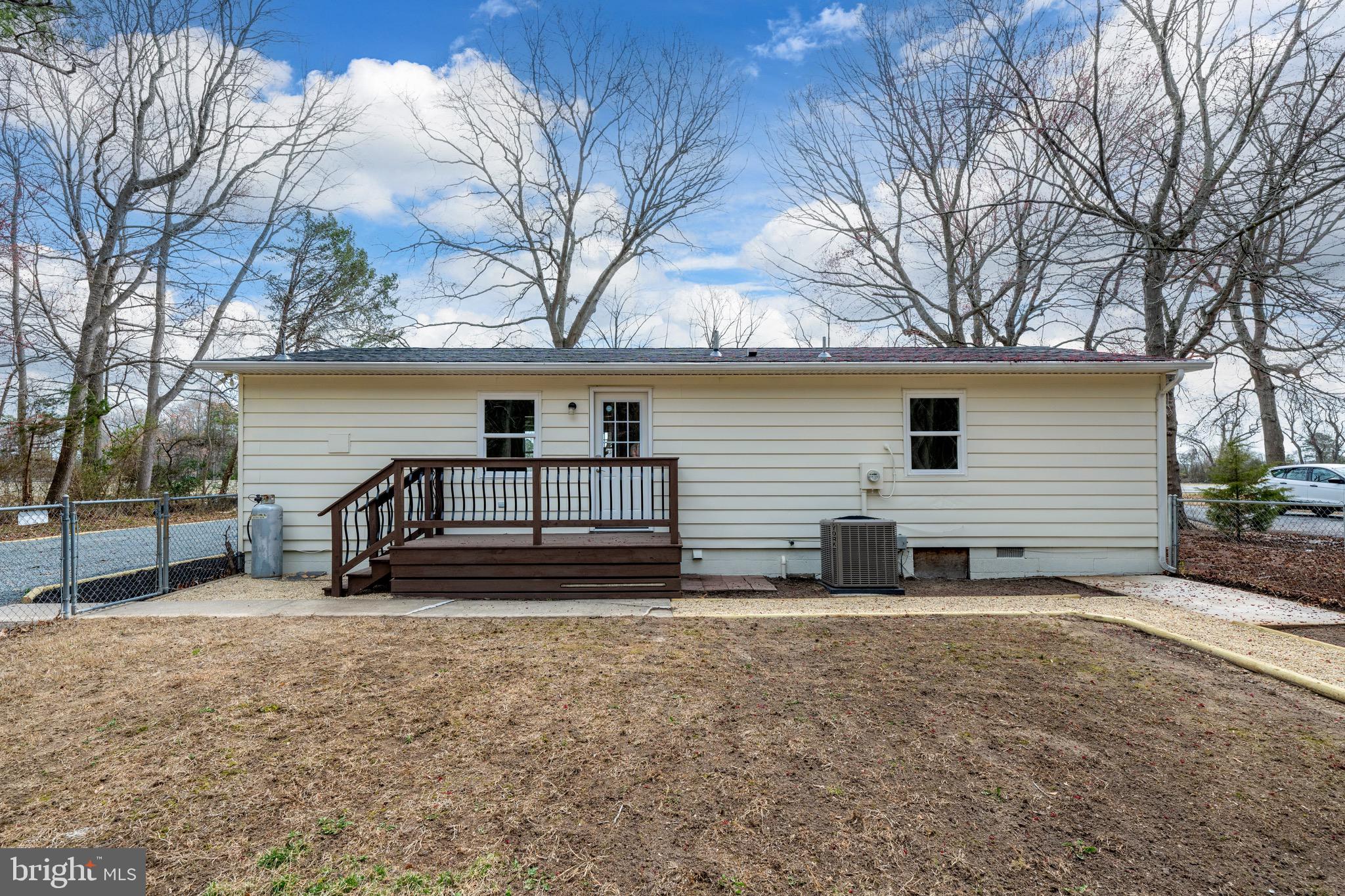 18316 Shingle Point Road Georgetown, DE 19947 - Photo 31 of 35 a view of a house with backyard and a tree