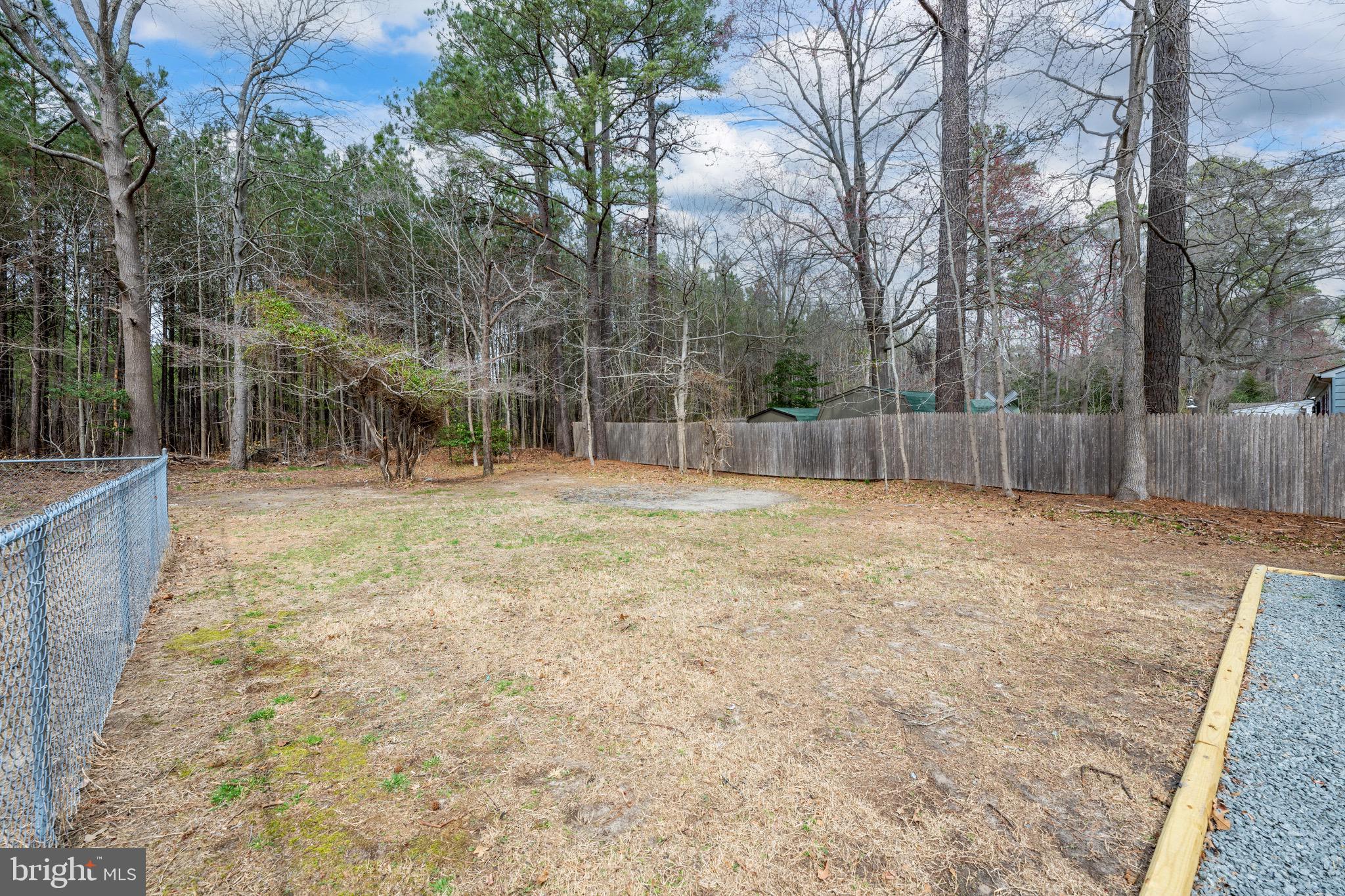 18316 Shingle Point Road Georgetown, DE 19947 - Photo 33 of 35 a swimming pool with outdoor seating and yard