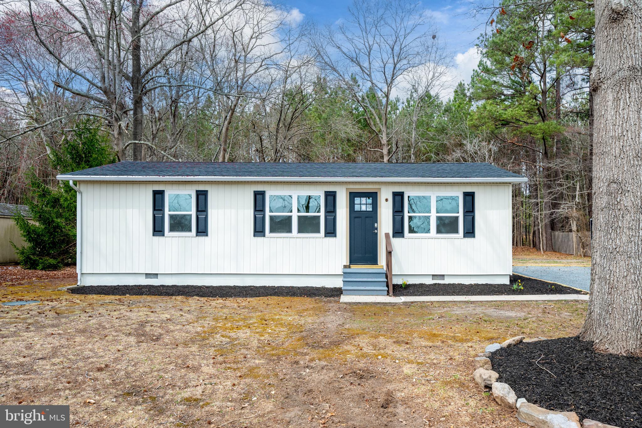 18316 Shingle Point Road Georgetown, DE 19947 - Photo 4 of 35 a view of a house with a yard