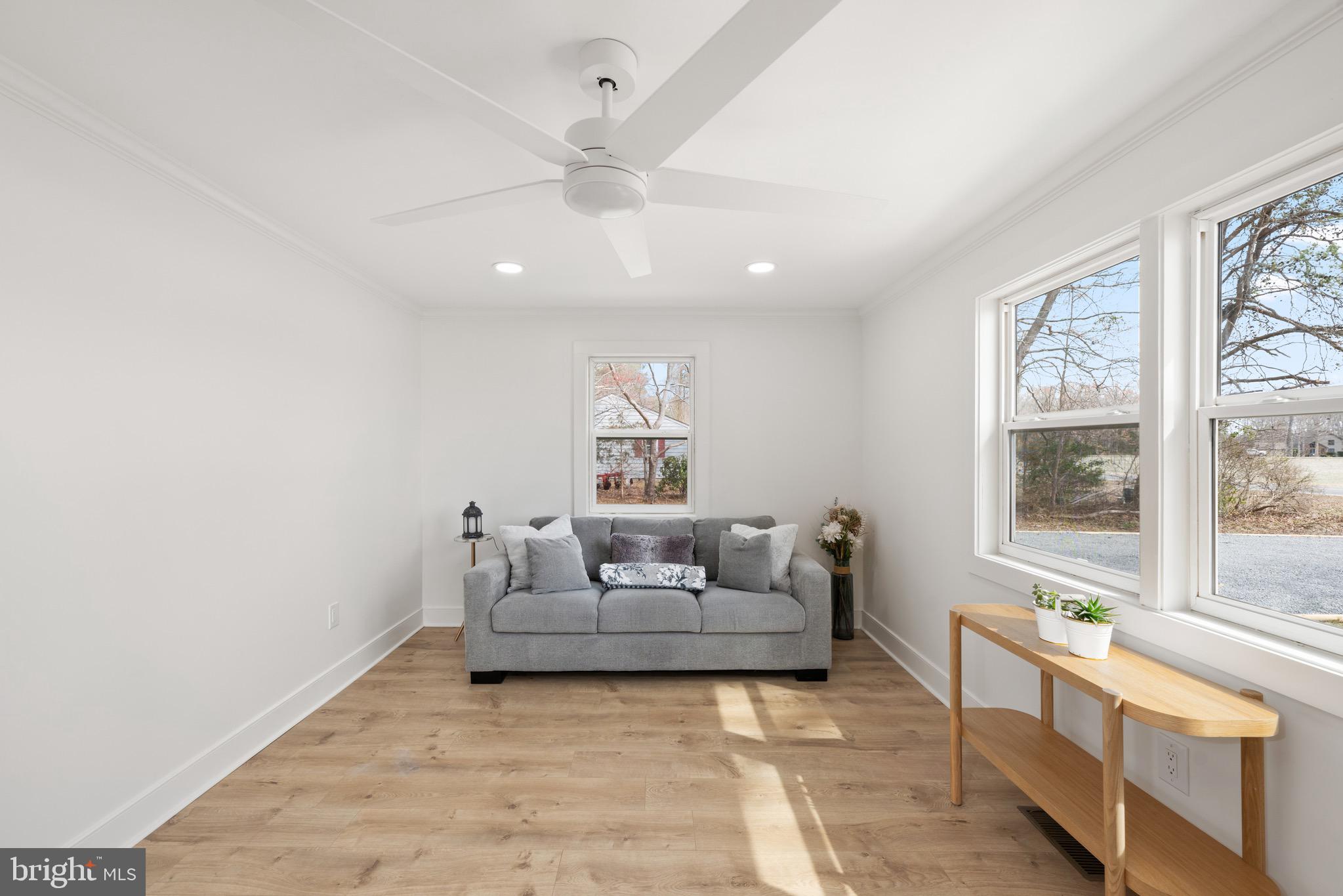 18316 Shingle Point Road Georgetown, DE 19947 - Photo 7 of 35 a living room with furniture and a large window