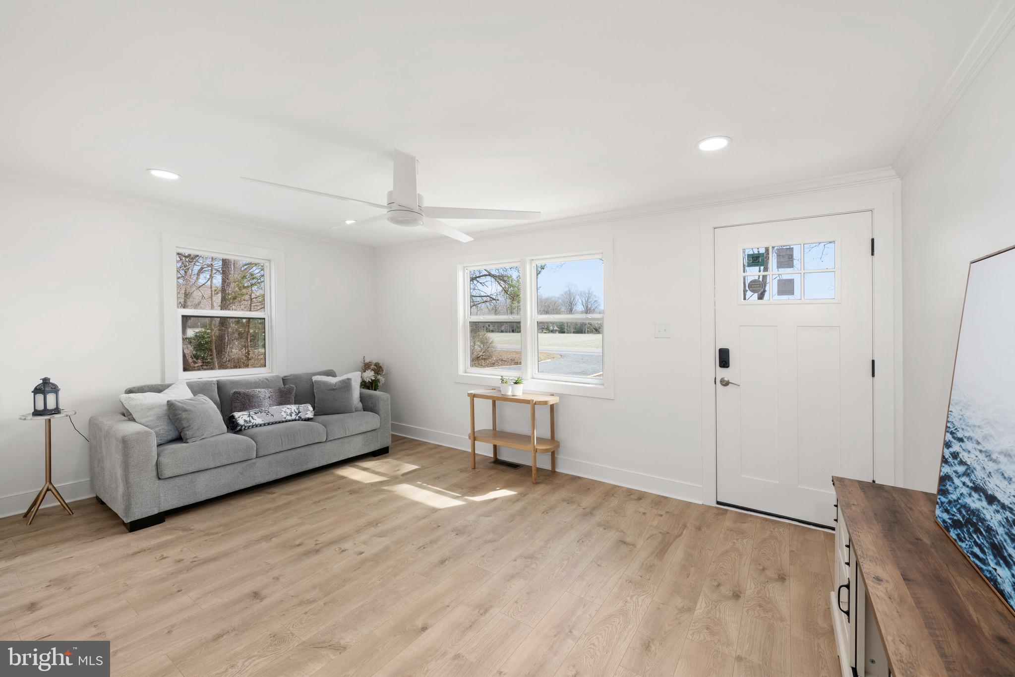 18316 Shingle Point Road Georgetown, DE 19947 - Photo 8 of 35 a living room with furniture and a window