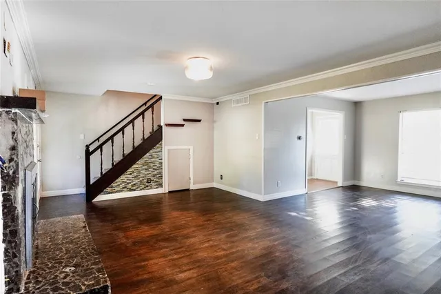 a view of an entryway with wooden floor