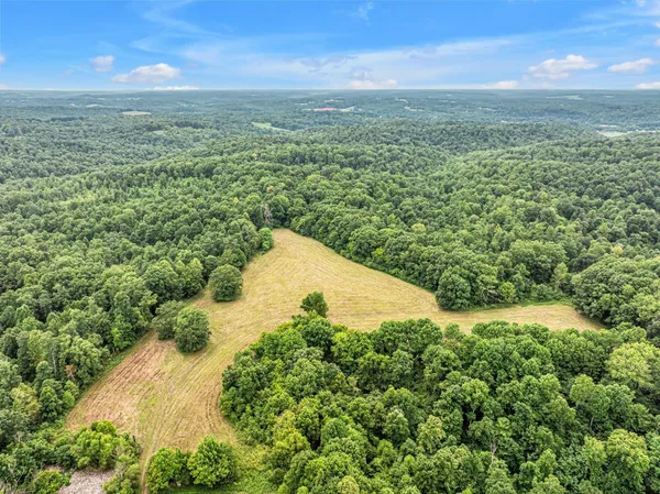 a view of a field with an outdoor space