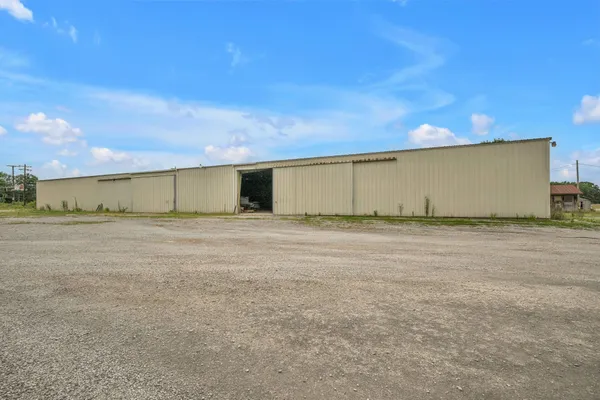 a swimming pool with outdoor seating and yard