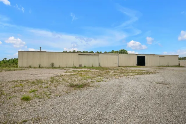 a view of a house with a yard and a garage