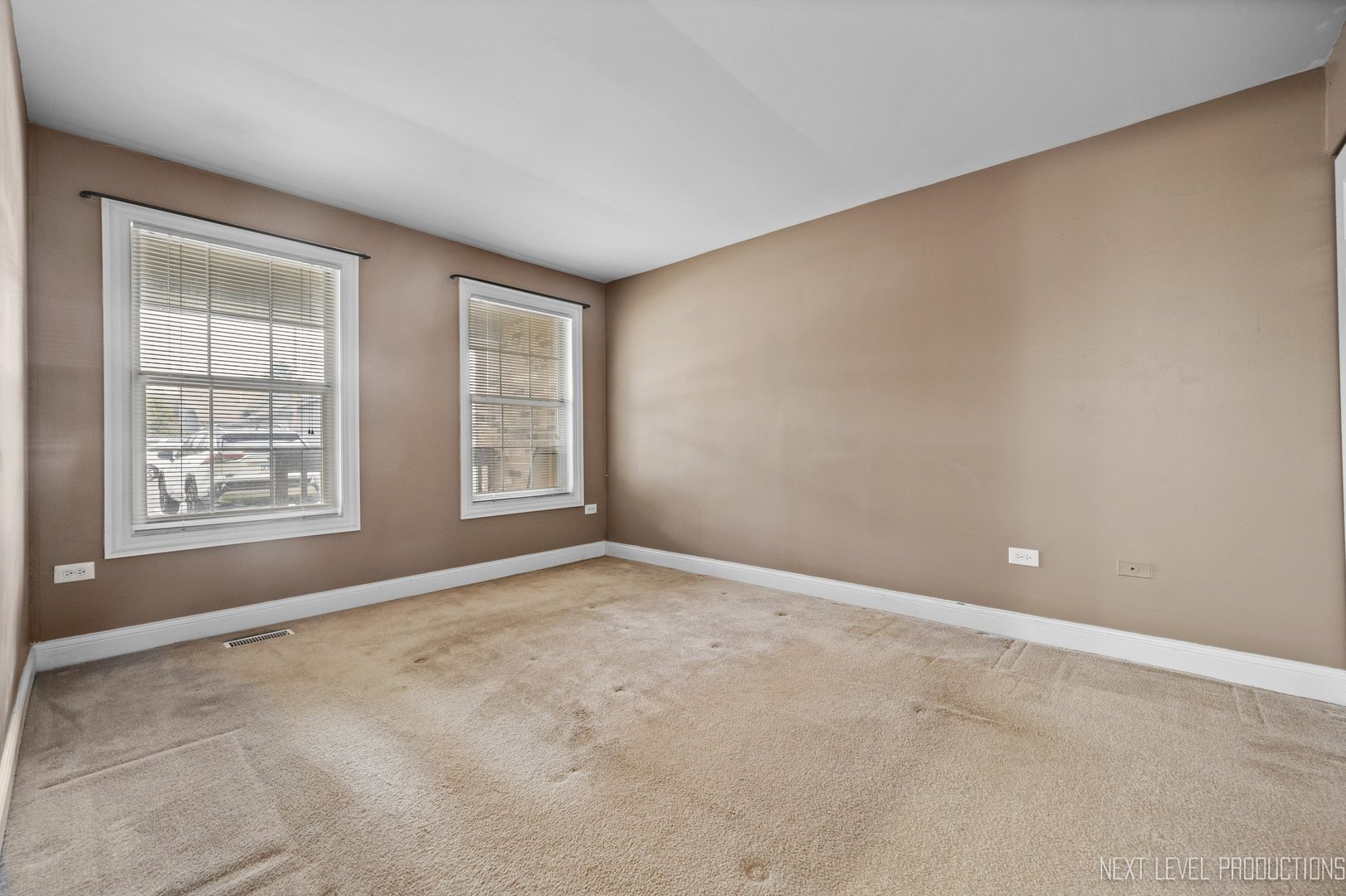 43 Foxcroft Road, Unit 119 Naperville, IL 60565 - Photo 11 of 13 an empty room with windows