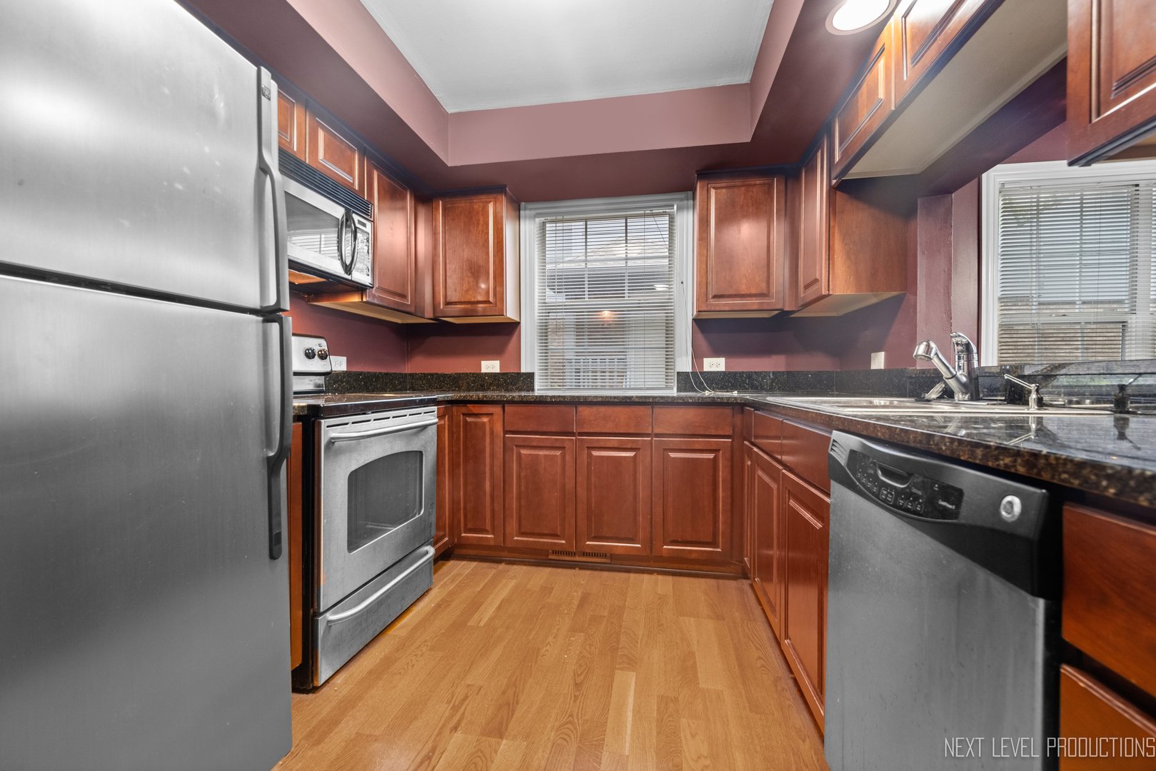 43 Foxcroft Road, Unit 119 Naperville, IL 60565 - Photo 8 of 13 a kitchen with a sink stove and cabinets