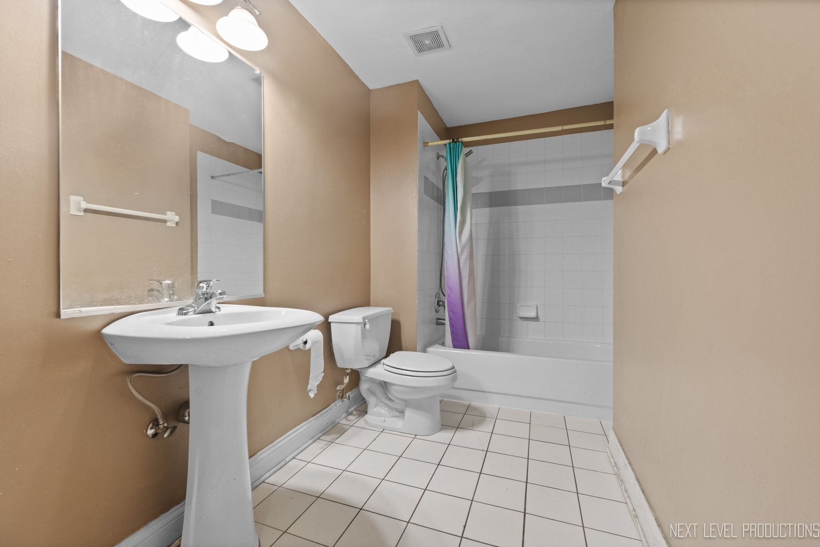 43 Foxcroft Road, Unit 119 Naperville, IL 60565 - Photo 9 of 13 a bathroom with a sink a toilet and shower