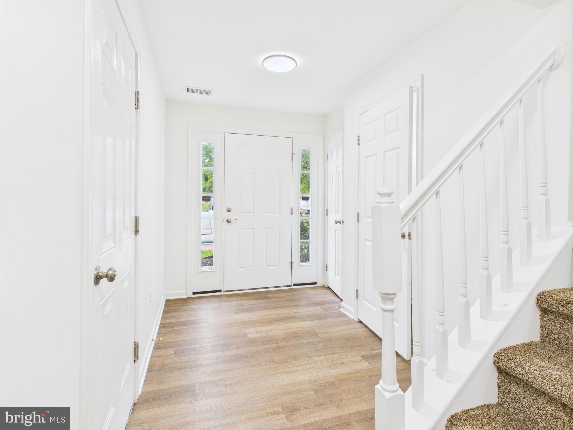 1233 Mare Street Ranson, WV 25438 - Photo 8 of 51 a view of a hallway with white walls and entryway