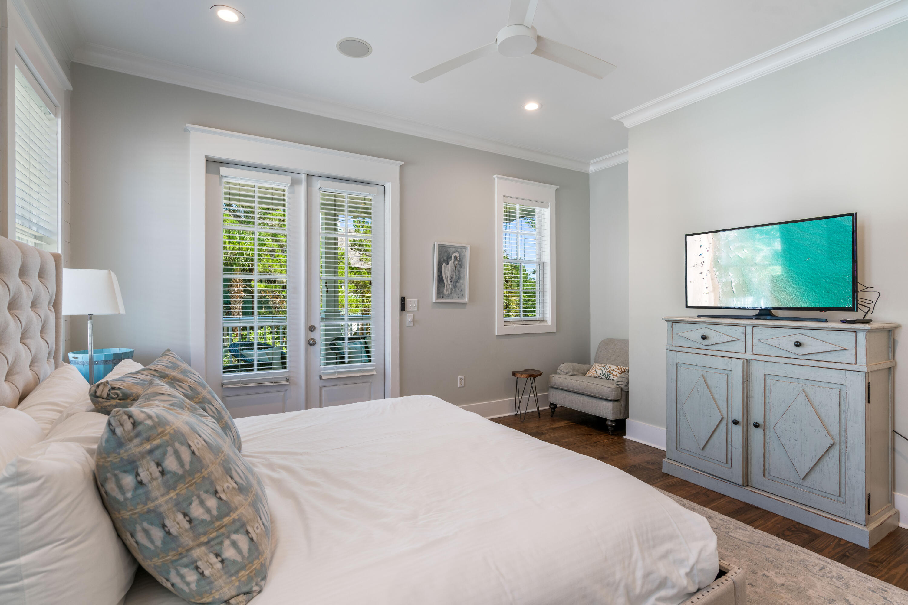 148 Coopersmith Lane Inlet Beach, FL 32461 - Photo 49 of 82 a bedroom with a large bed and a flat tv screen on dresser