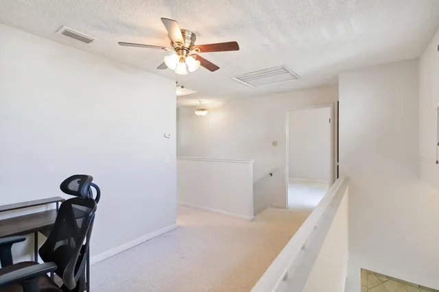 a view of a hallway with closet