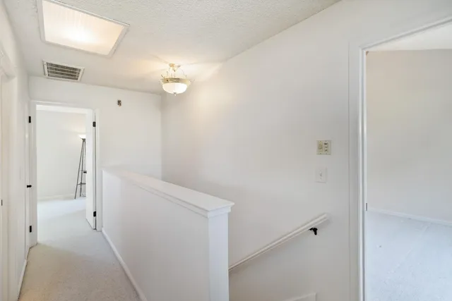 a view of a hallway with closet