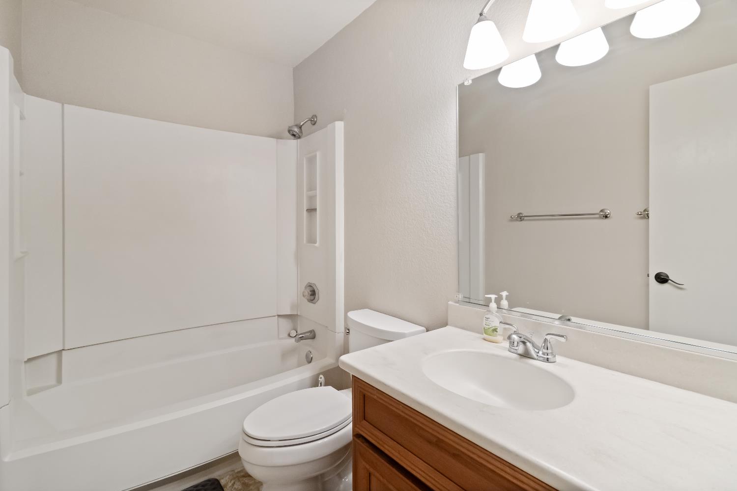 2831 Edison Avenue Sacramento, CA 95821 - Photo 18 of 27 a bathroom with a sink a toilet and a mirror