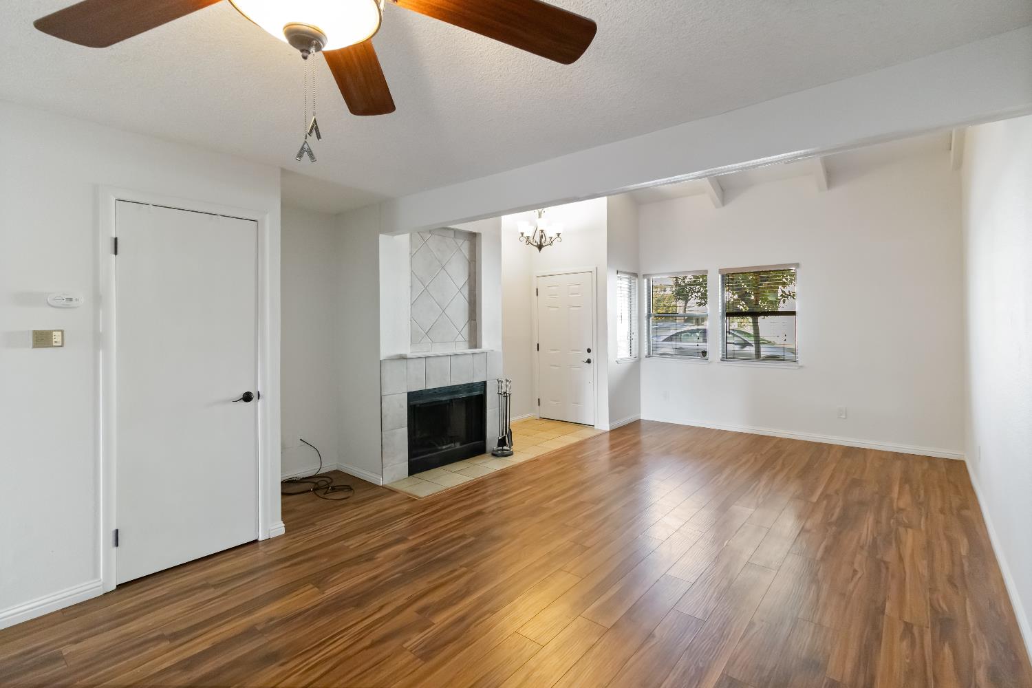 2831 Edison Avenue Sacramento, CA 95821 - Photo 2 of 27 wooden floor in an empty room with a fireplace