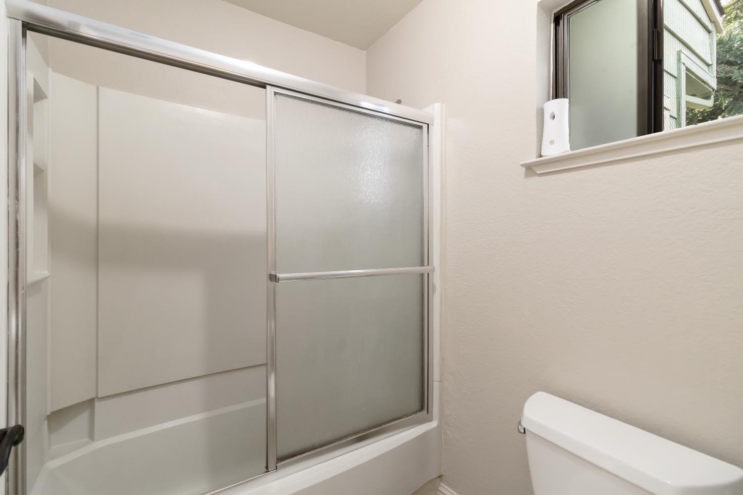 2831 Edison Avenue Sacramento, CA 95821 - Photo 24 of 27 a bathroom with a shower and a toilet
