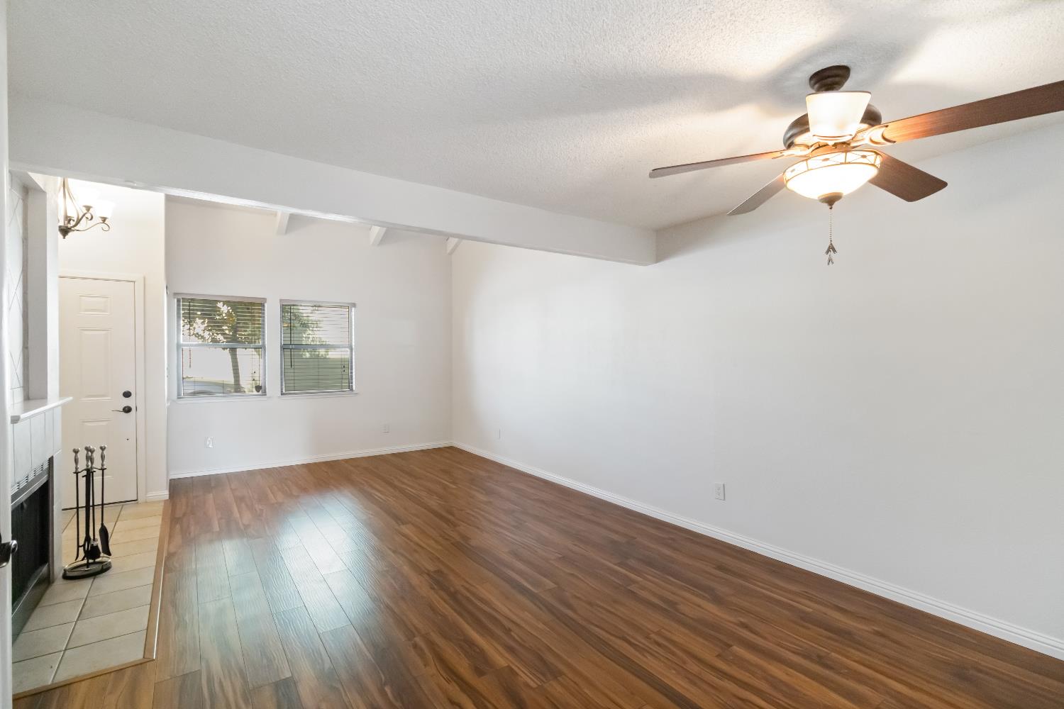 2831 Edison Avenue Sacramento, CA 95821 - Photo 3 of 27 an empty room with wooden floor fan and windows