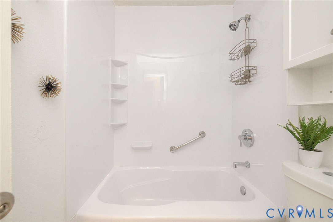 3520 East Richmond Road, Unit U106 Richmond, VA 23223 - Photo 15 of 18 a white bath tub sitting next to a white sink