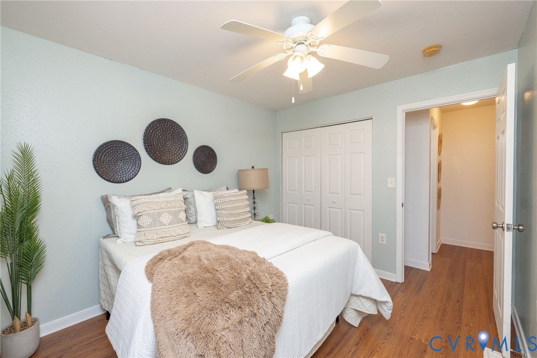 3520 East Richmond Road, Unit U106 Richmond, VA 23223 - Photo 17 of 18 a bedroom with a bed and a chandelier