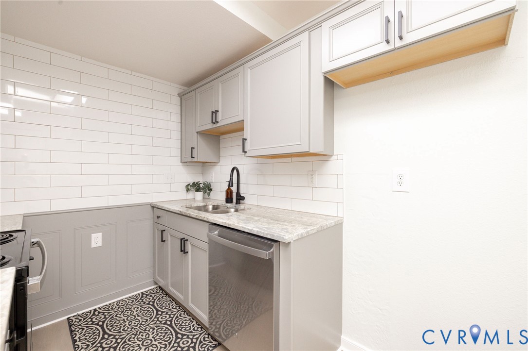 3520 East Richmond Road, Unit U106 Richmond, VA 23223 - Photo 7 of 18 a kitchen with a sink and cabinets