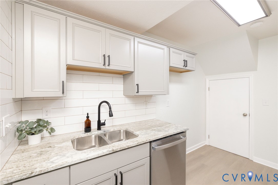 3520 East Richmond Road, Unit U106 Richmond, VA 23223 - Photo 8 of 18 a kitchen with a sink and cabinets