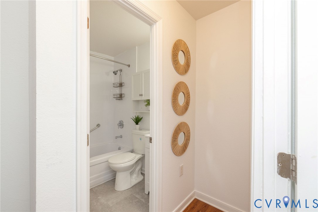 3520 East Richmond Road, Unit U106 Richmond, VA 23223 - Photo 9 of 18 a bathroom with a toilet and a shower