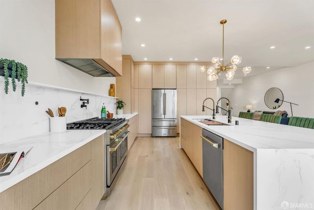 a kitchen with a sink and stove