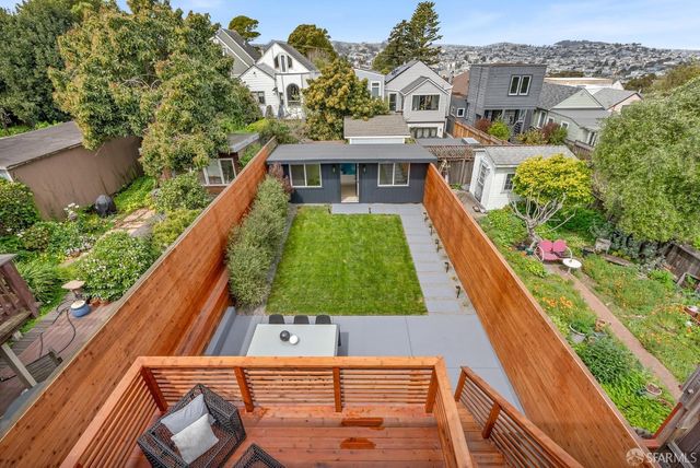 a white bath tub sitting next to a white toilet and sink