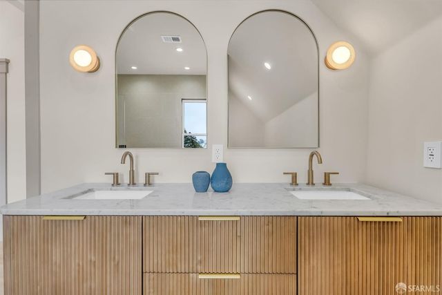 a bedroom with bed and a window