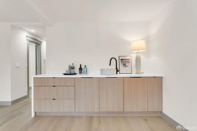 a bathroom with a sink a toilet and mirror
