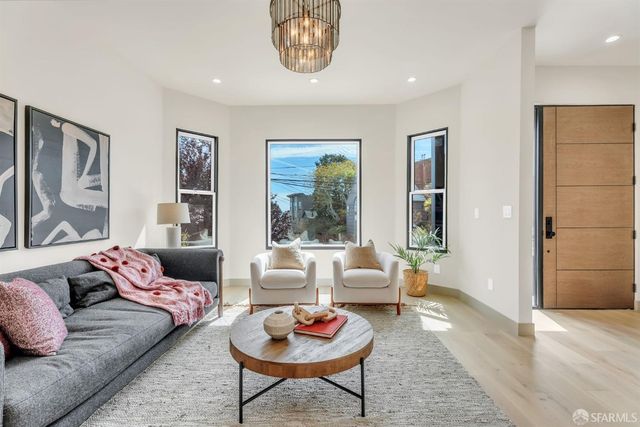 a living room with furniture and a rug