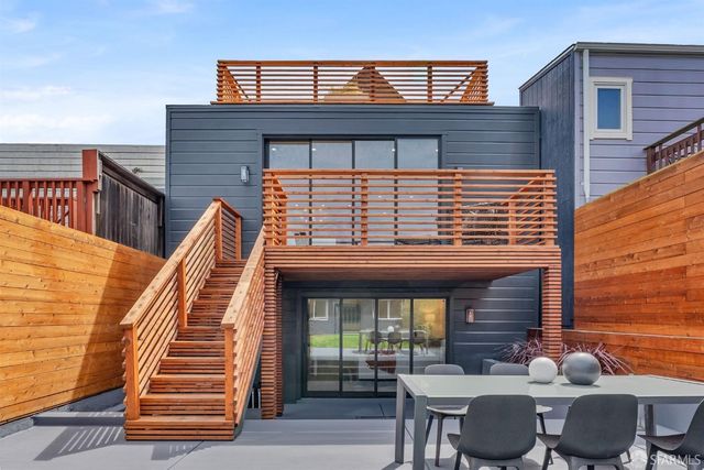a view of a hallway with entryway wooden floor and front door