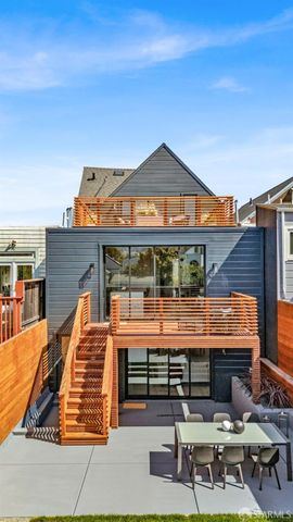 an aerial view of a house with a garden potted plants